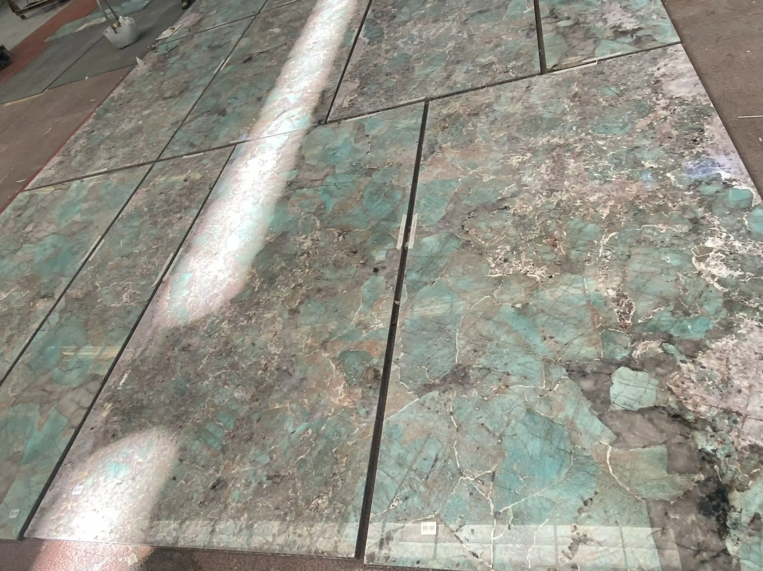 amazon-blue-granite-floor-tile-application-02.webp amazon blue granite floor tile application with blue green mineral texture