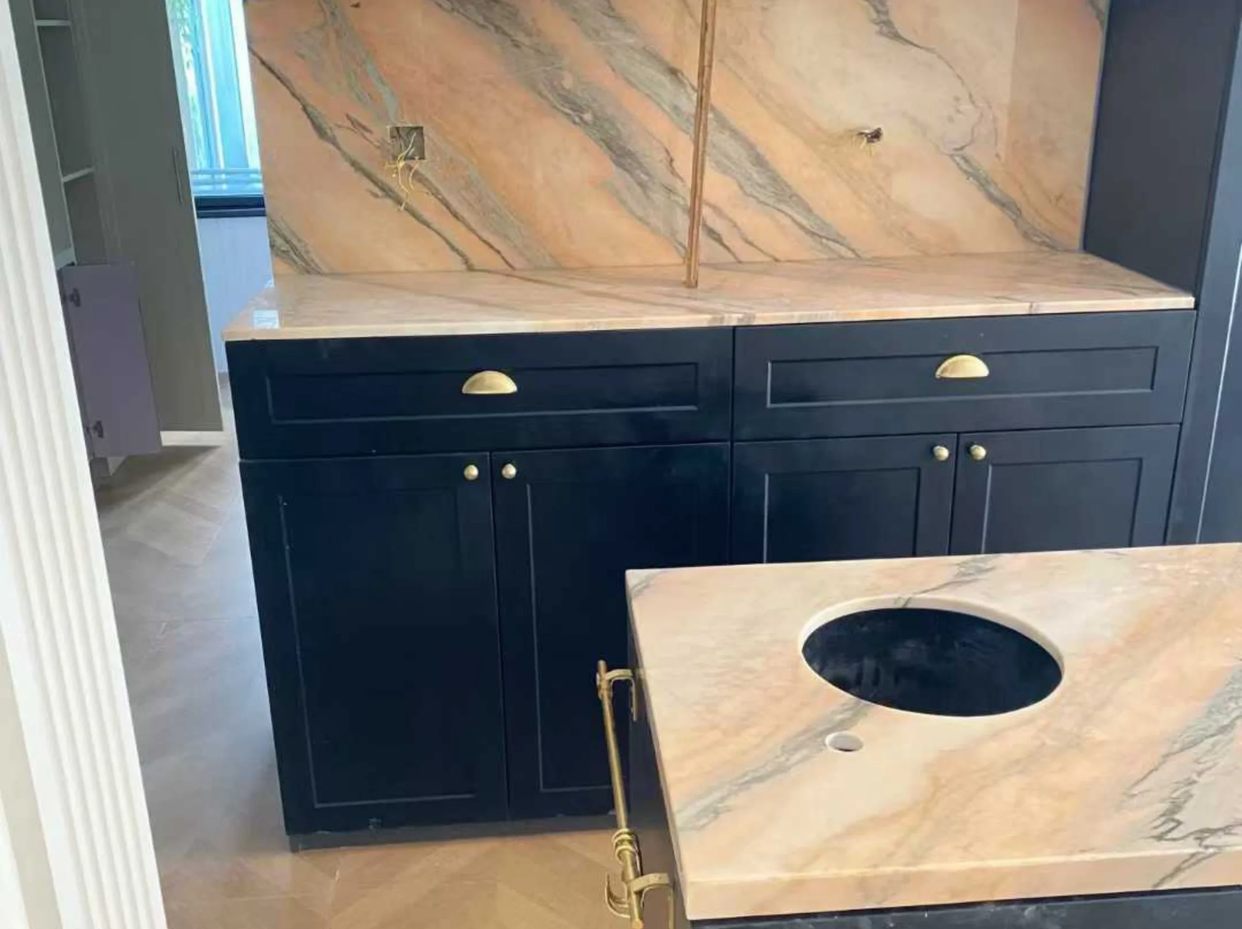 rosa-portugal-marble-vanity-countertop-backsplash.webp Rosa Portugal Marble vanity countertop and backsplash with soft pink beige tone and grey-green veining