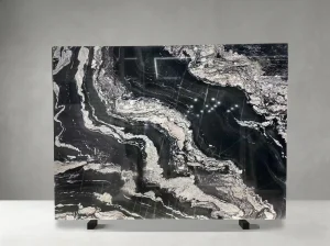 titanium black granite slab with flowing white veins for walls and islands
