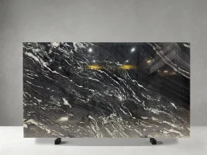 titanium mc granite slab with flowing white veins for walls and islands
