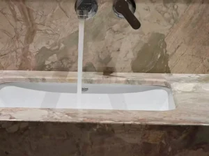beige breccia botticelli marble bathroom vanity sink detail with soft beige breccia texture