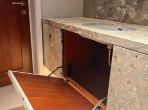 beige breccia botticelli marble vanity top cabinet detail with custom sink opening