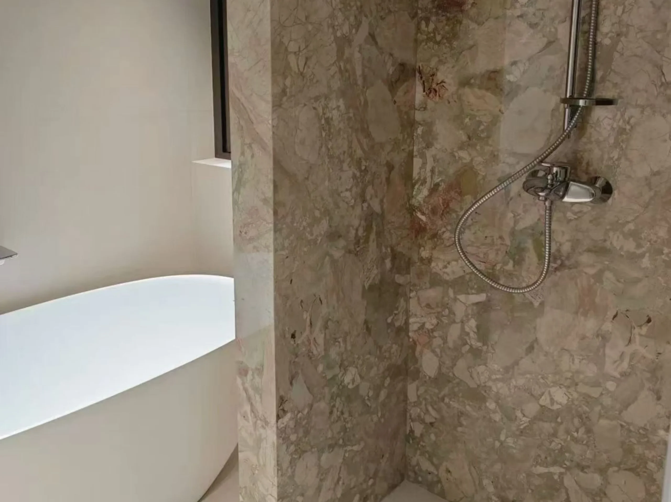 breccia-botticelli-marble-bathroom-shower-wall-02.webp breccia botticelli marble bathroom shower wall with beige green and blush breccia texture