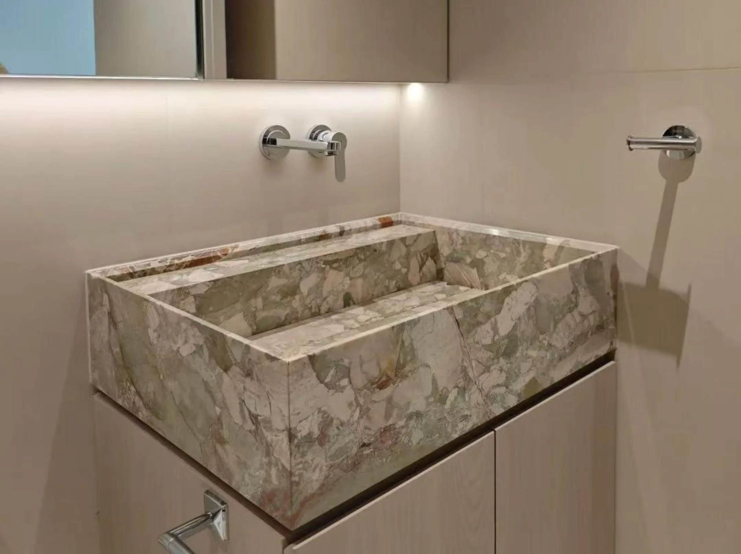 ceppo-siciliana-marble-bathroom-sink-vanity-01.webp ceppo siciliana marble bathroom sink vanity with soft beige breccia texture