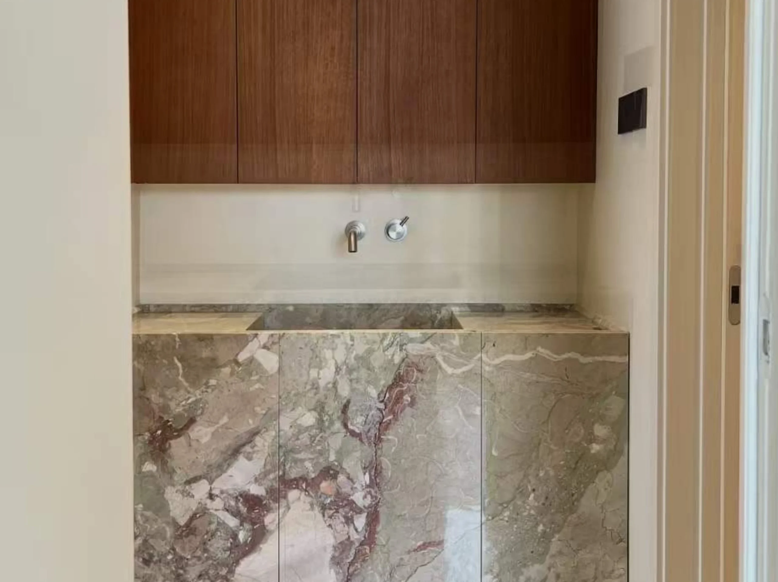 ceppo-siciliano-marble-bathroom-vanity-cabinet-02.webp ceppo siciliano marble bathroom vanity cabinet with soft green pink breccia pattern