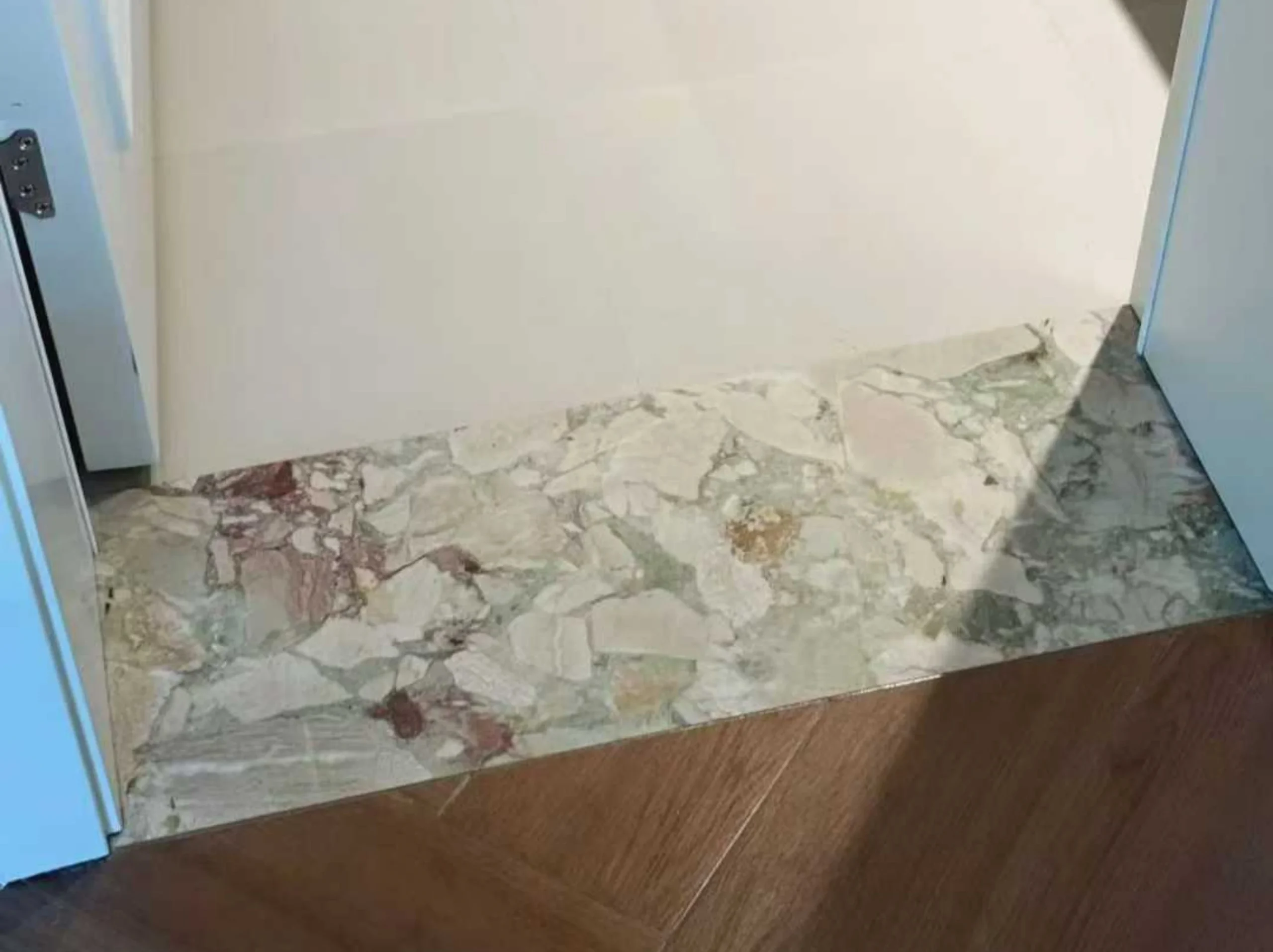 green-breccia-botticelli-marble-floor-threshold-detail-03.webp green breccia botticelli marble floor threshold detail with soft green beige breccia pattern