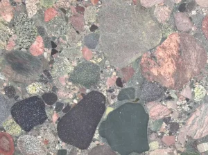 green colorful granite close up pebble texture with multicolor mineral fragments