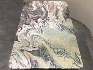 luana red marble tabletop detail with dramatic natural veining