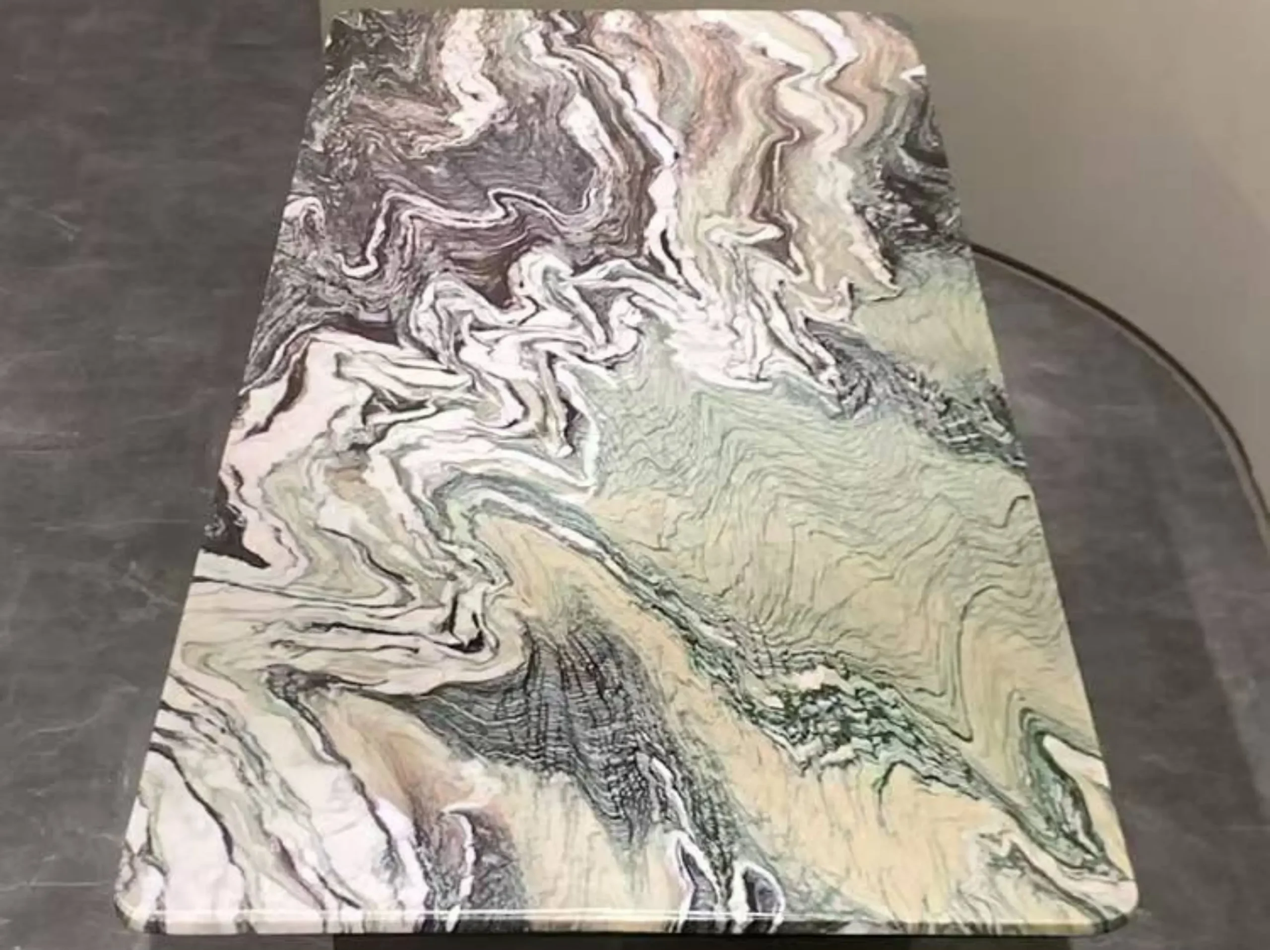 luana-red-marble-tabletop-detail-01.webp luana red marble tabletop detail with dramatic natural veining