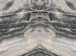 orobico grey marble bookmatched wall panel with grey black symmetrical pattern