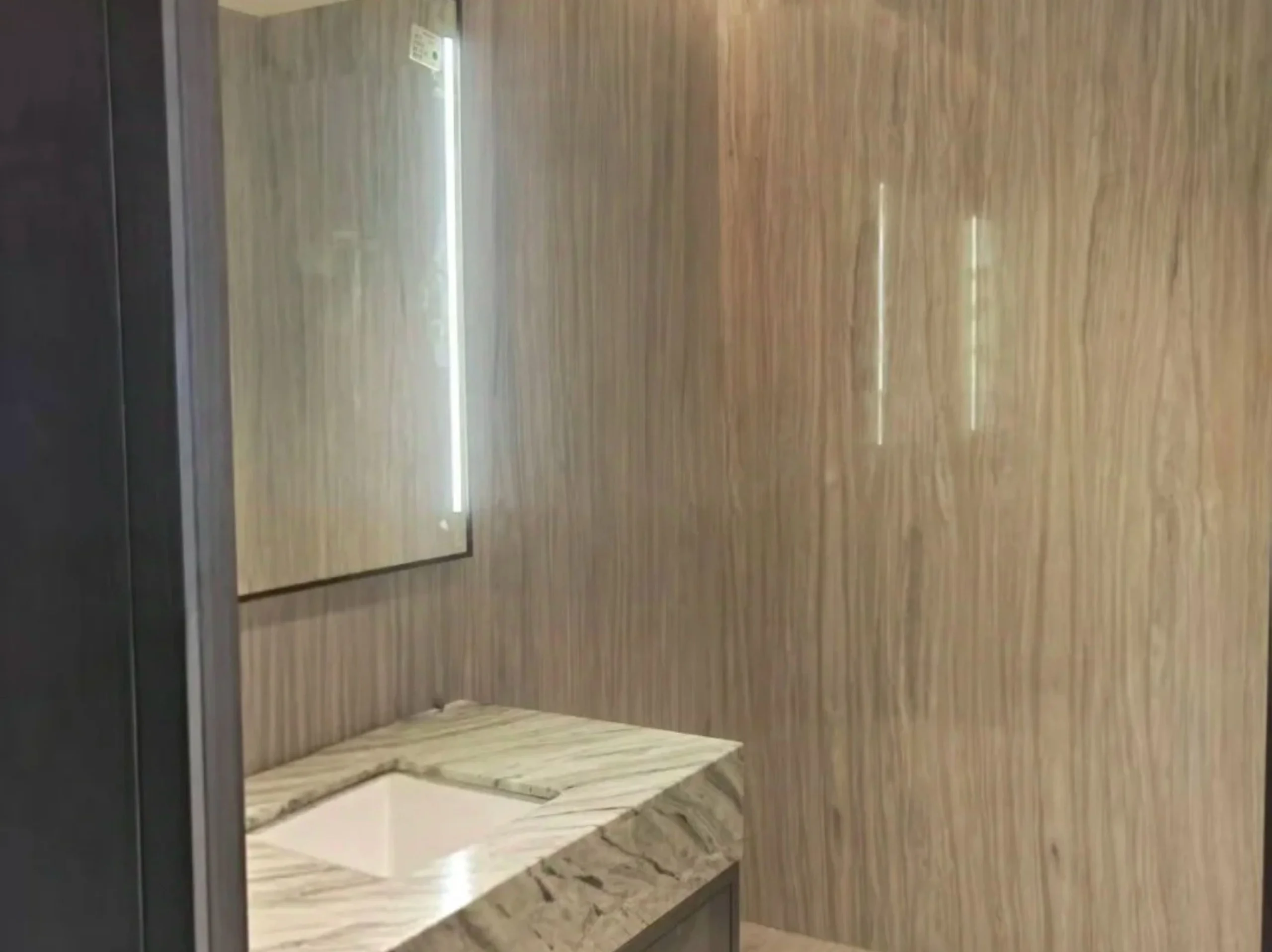 silk-georgette-marble-bathroom-wall-vanity-01.webp silk georgette marble bathroom wall cladding and vanity top with soft grey wooden vein