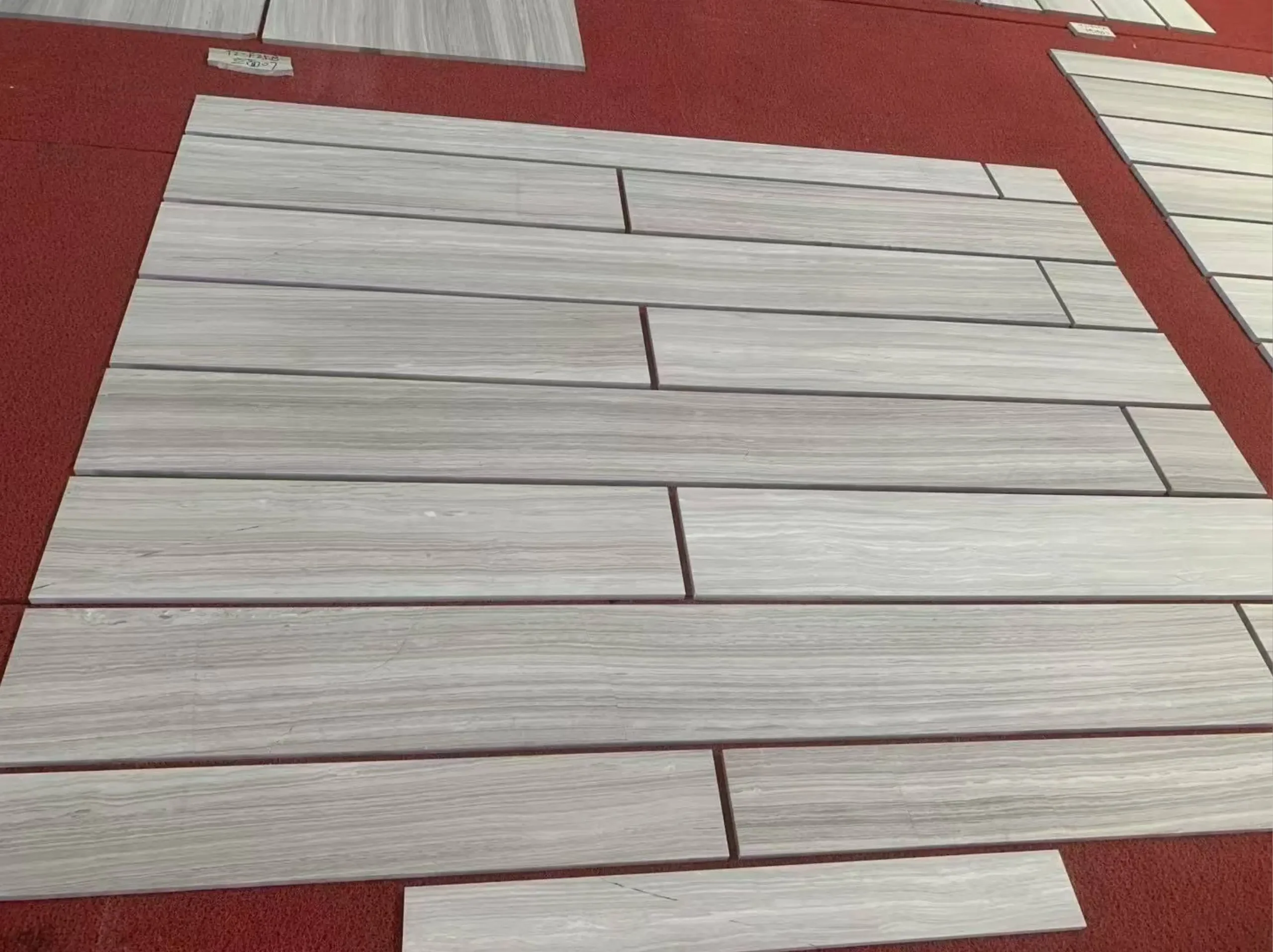 silk-georgette-marble-floor-tiles-layout-03.webp silk georgette marble floor tiles layout with horizontal grey wooden vein
