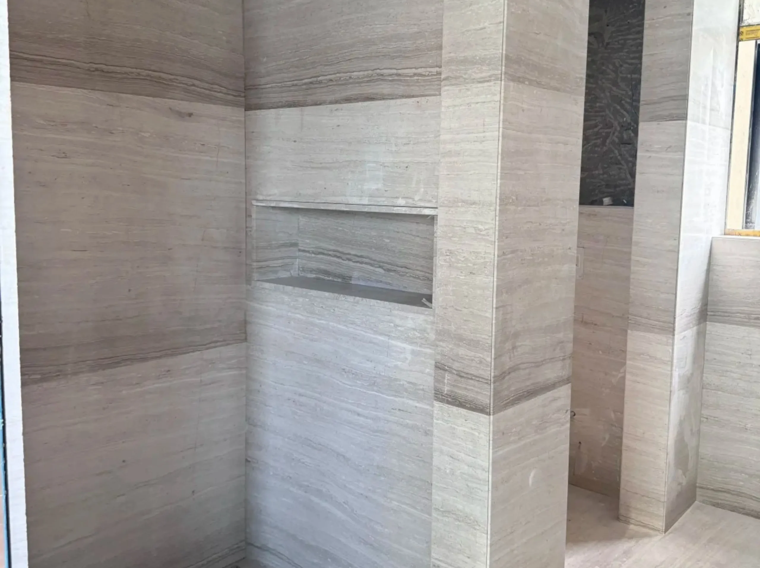 white-wooden-marble-bathroom-wall-cladding-02.webp white wooden marble bathroom wall cladding with horizontal grey wooden vein