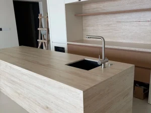 Afghan Travertine kitchen island sink with matching full-height backsplash