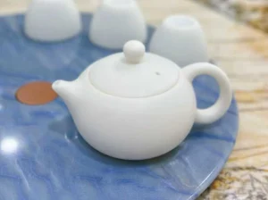 Azul Imperial Quartzite tabletop with a white ceramic teapot