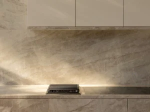 Beige Matira Quartzite kitchen countertop and full-height backsplash with integrated cooktop