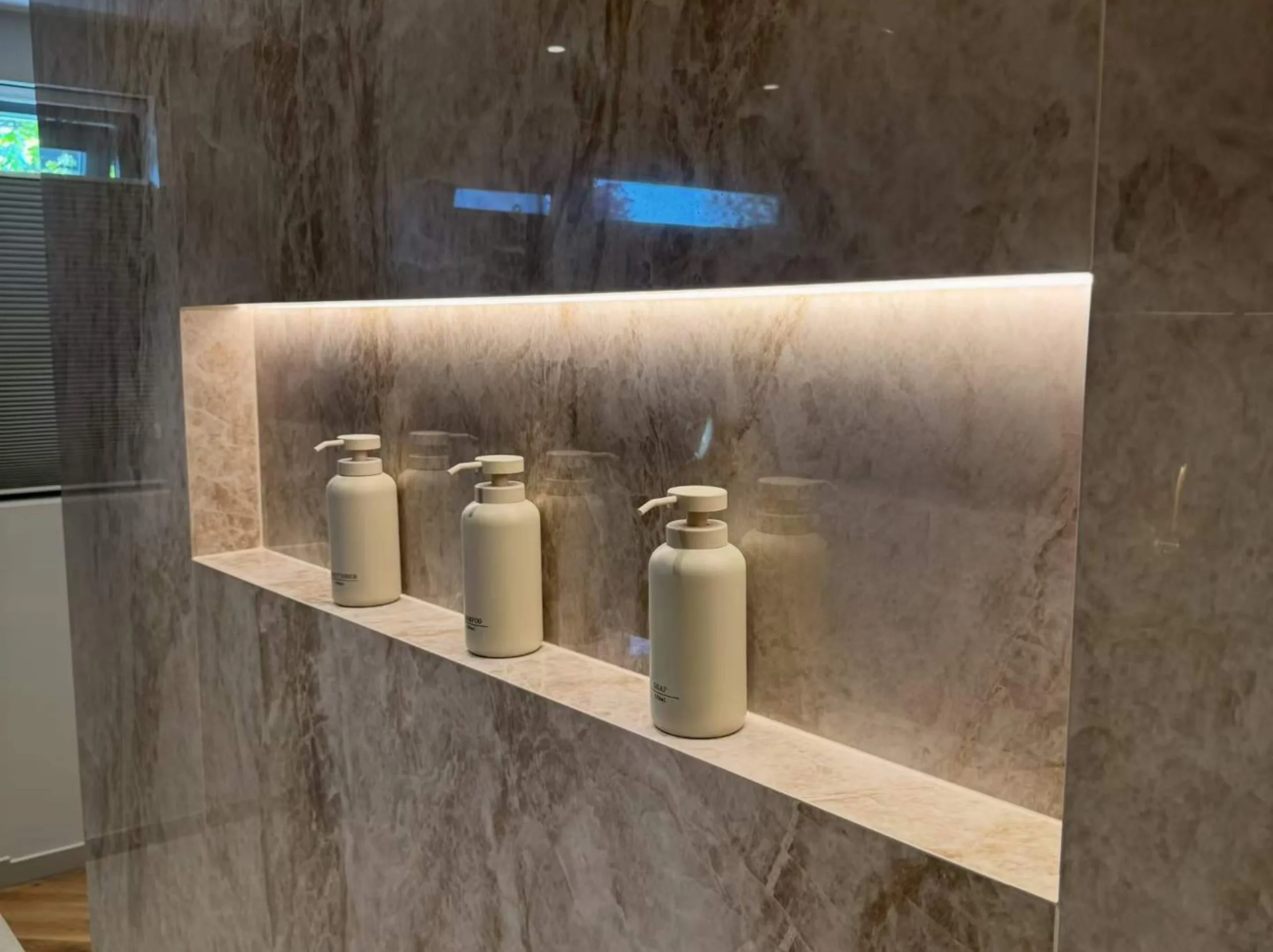 beige-taj-mahal-quartzite-bathroom-wall-niche.webp Beige Taj Mahal Quartzite bathroom wall cladding with a custom shower niche