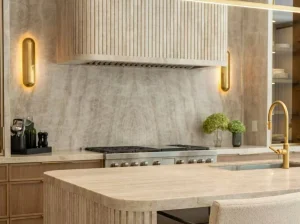 Beige Taj Mahal Quartzite kitchen island with warm ivory tones in a luxury interior