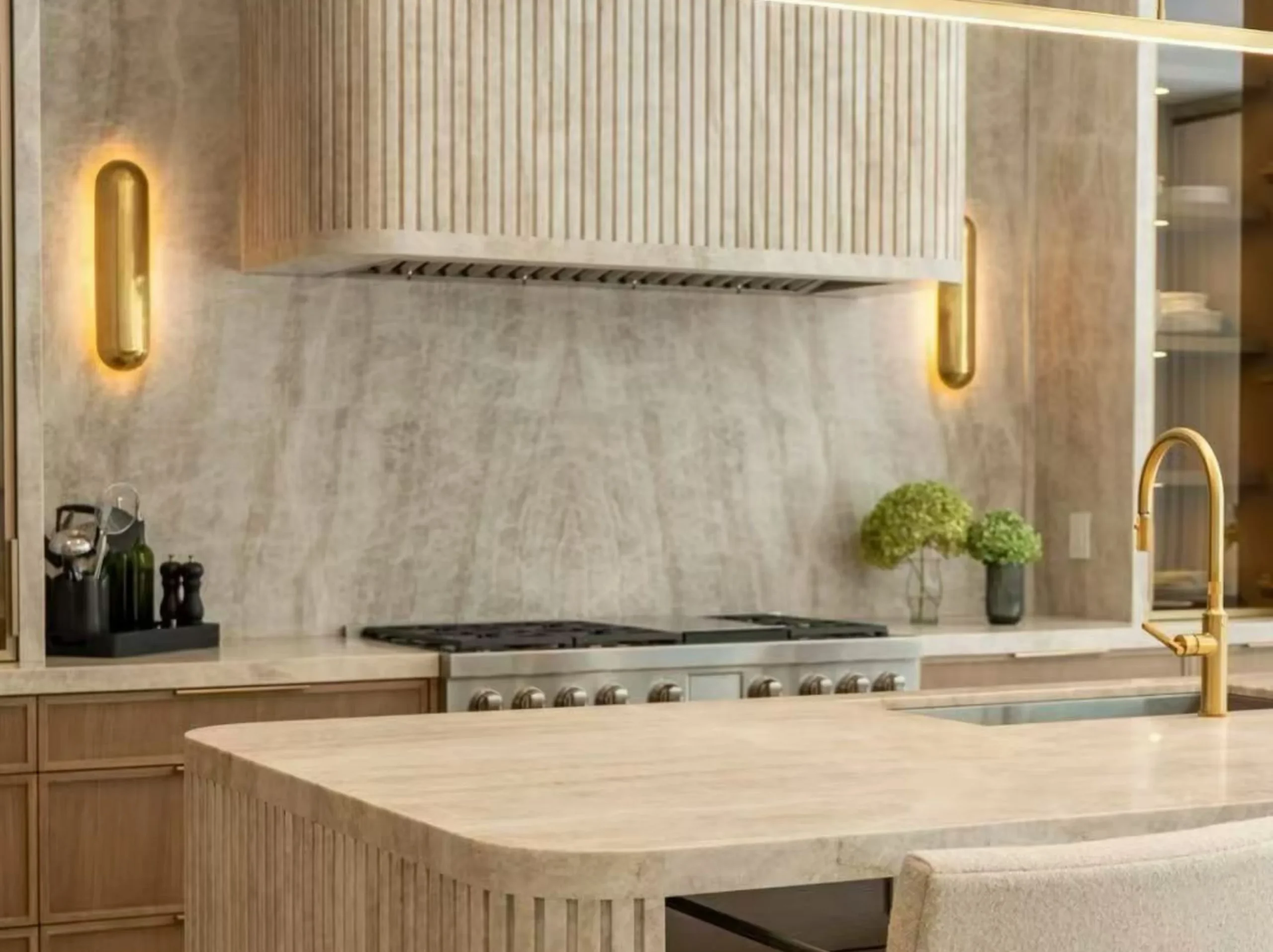 beige-taj-mahal-quartzite-kitchen-island-hero.webp Beige Taj Mahal Quartzite kitchen island with warm ivory tones in a luxury interior