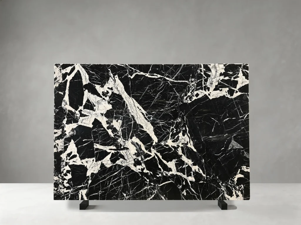 black petit antique marble slab with deep black base and white breccia veining