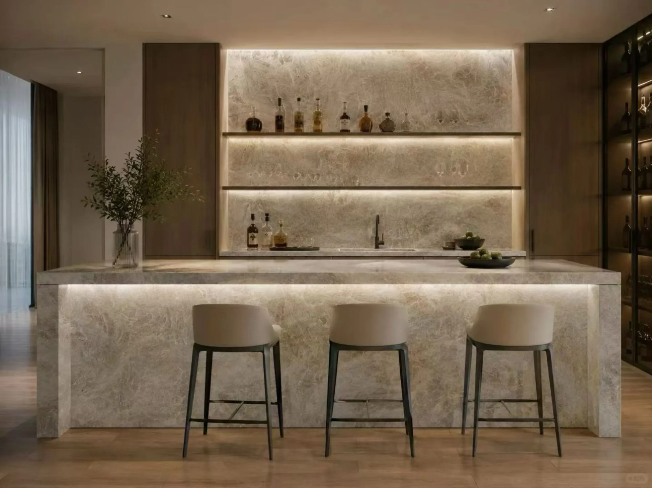 branco-taj-mahal-quartzite-backlit-bar.webp Branco Taj Mahal Quartzite backlit bar with matching countertop and wall panels