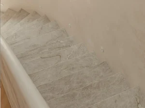 Branco Taj Mahal Quartzite staircase with custom treads and risers