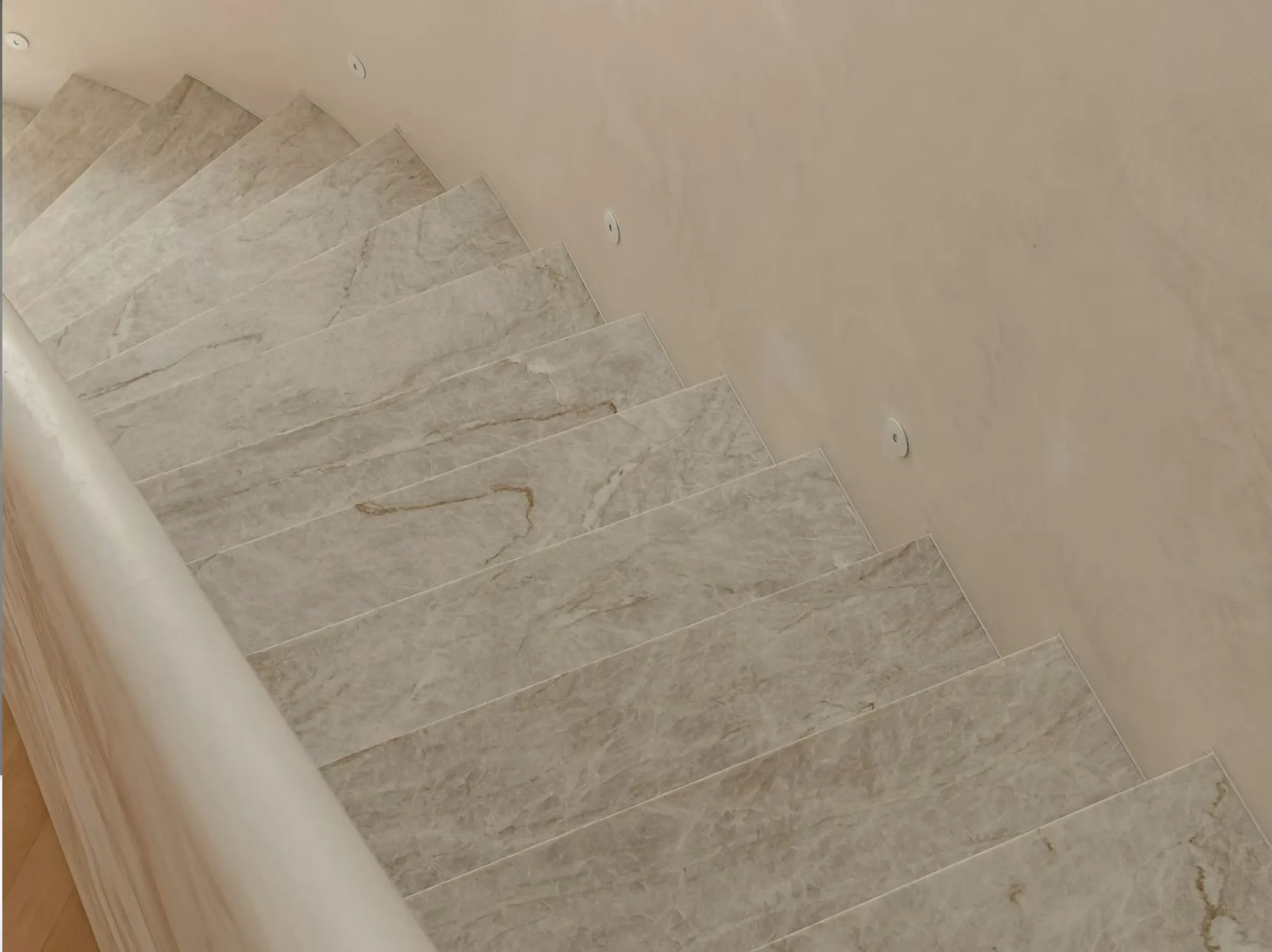 branco-taj-mahal-quartzite-stair-treads.webp Branco Taj Mahal Quartzite staircase with custom treads and risers