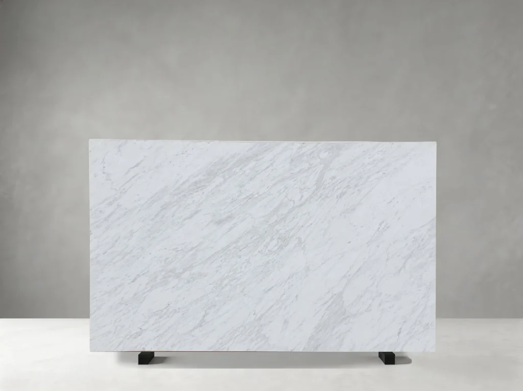 Full Branco Volakas Marble slab with a bright white background and cloudy grey veining