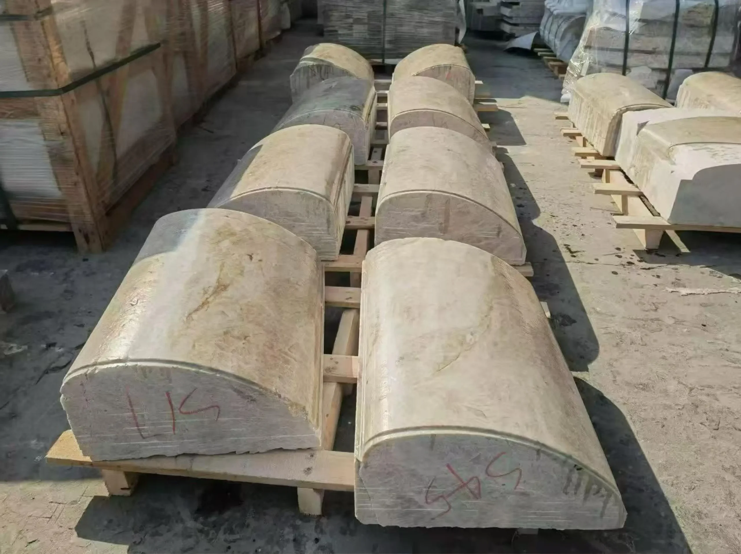 brazilian-taj-mahal-quartzite-semi-round-column-components.webp Custom semi-round Brazilian Taj Mahal Quartzite column components arranged in the stone factory