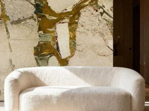 Breccia Romana Marble sofa feature wall with cream and olive-green patterns