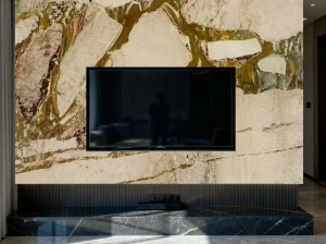 Breccia Romana Marble TV feature wall in a contemporary living room