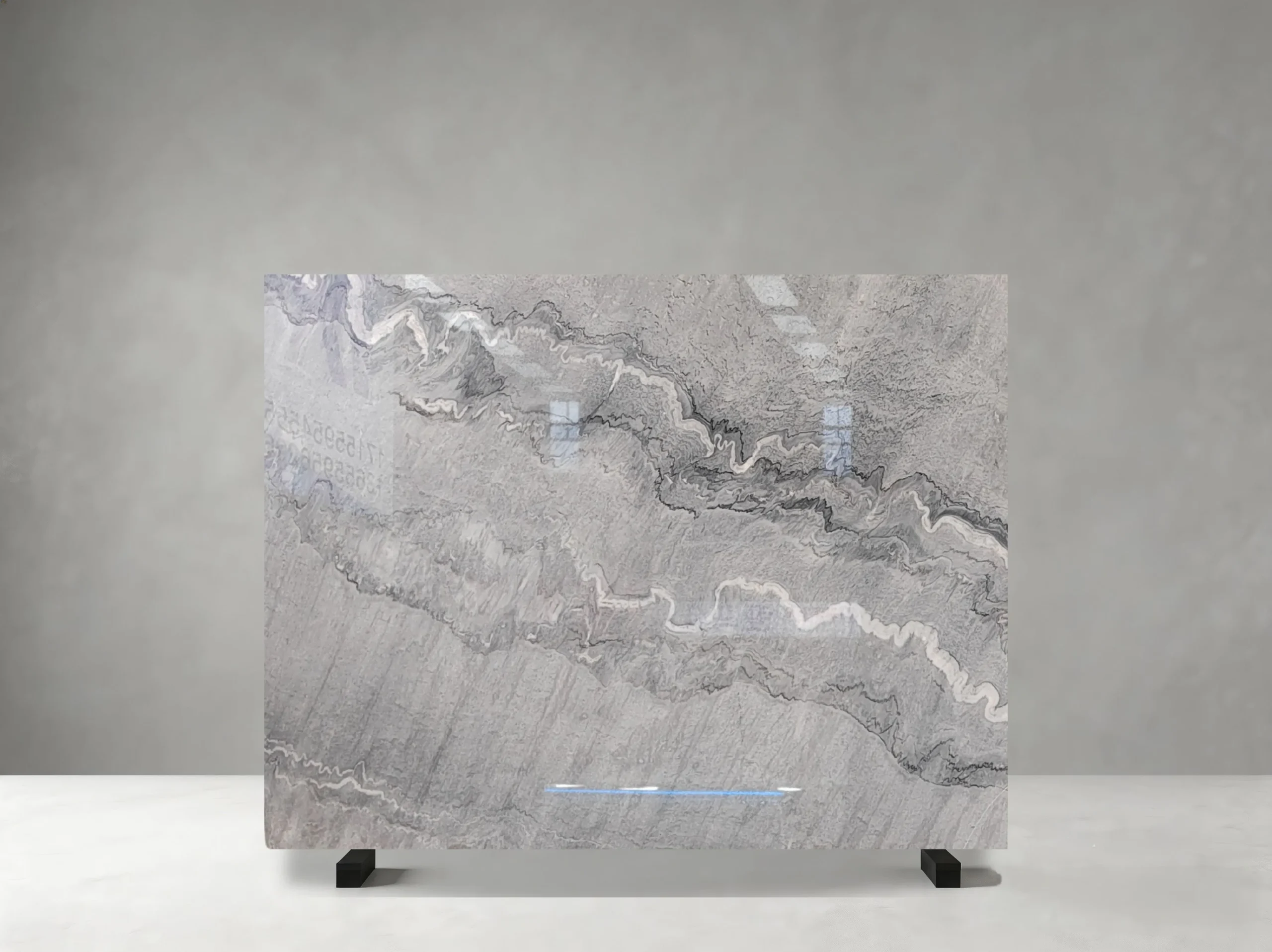 bruce-gray-marble-slab-light-grey-movement-05.webp bruce gray marble slab with light grey layered movement and soft white veining