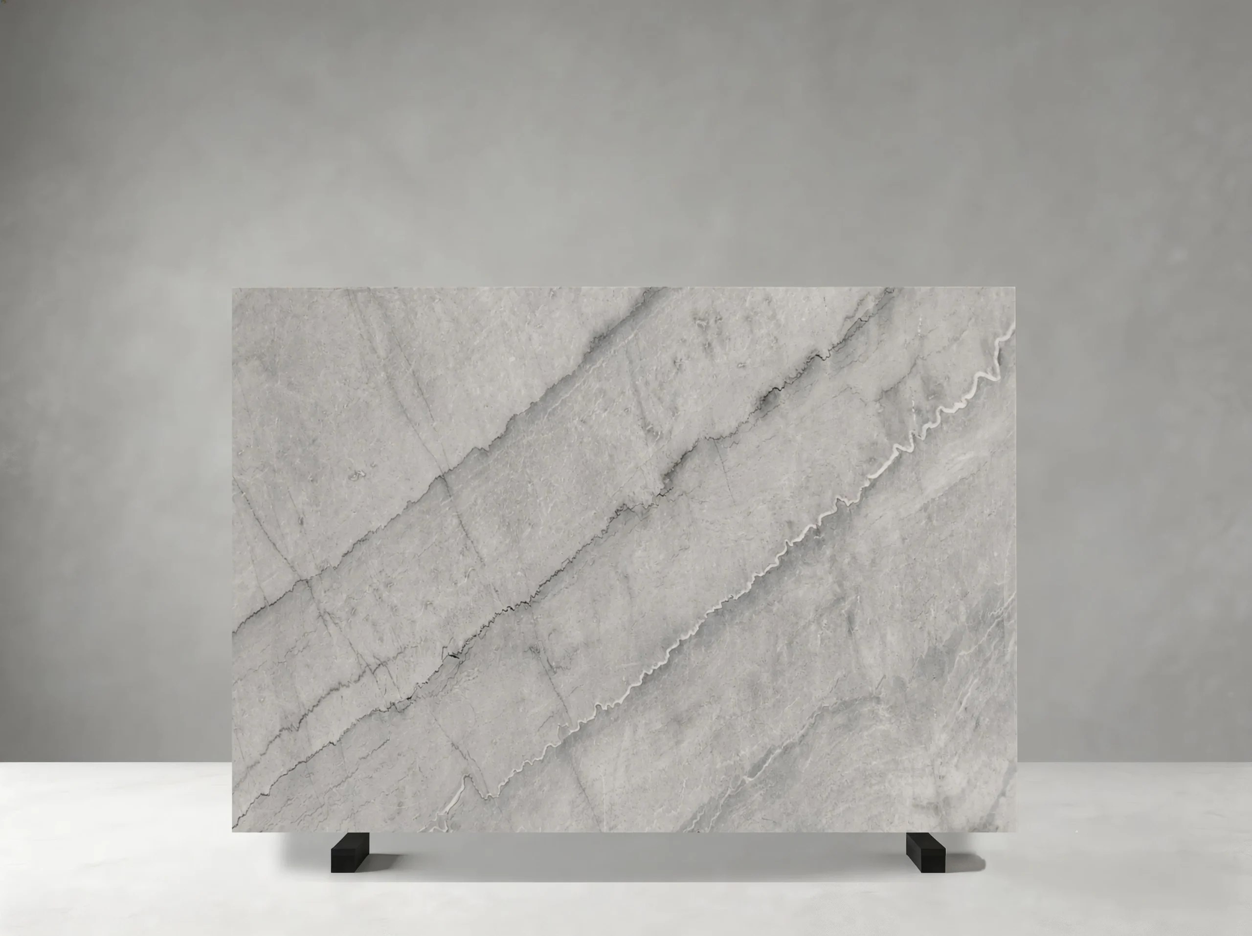 bruce-grey-marble-slab-soft-grey-movement-05.webp bruce grey marble slab with soft light grey diagonal movement and subtle white veining