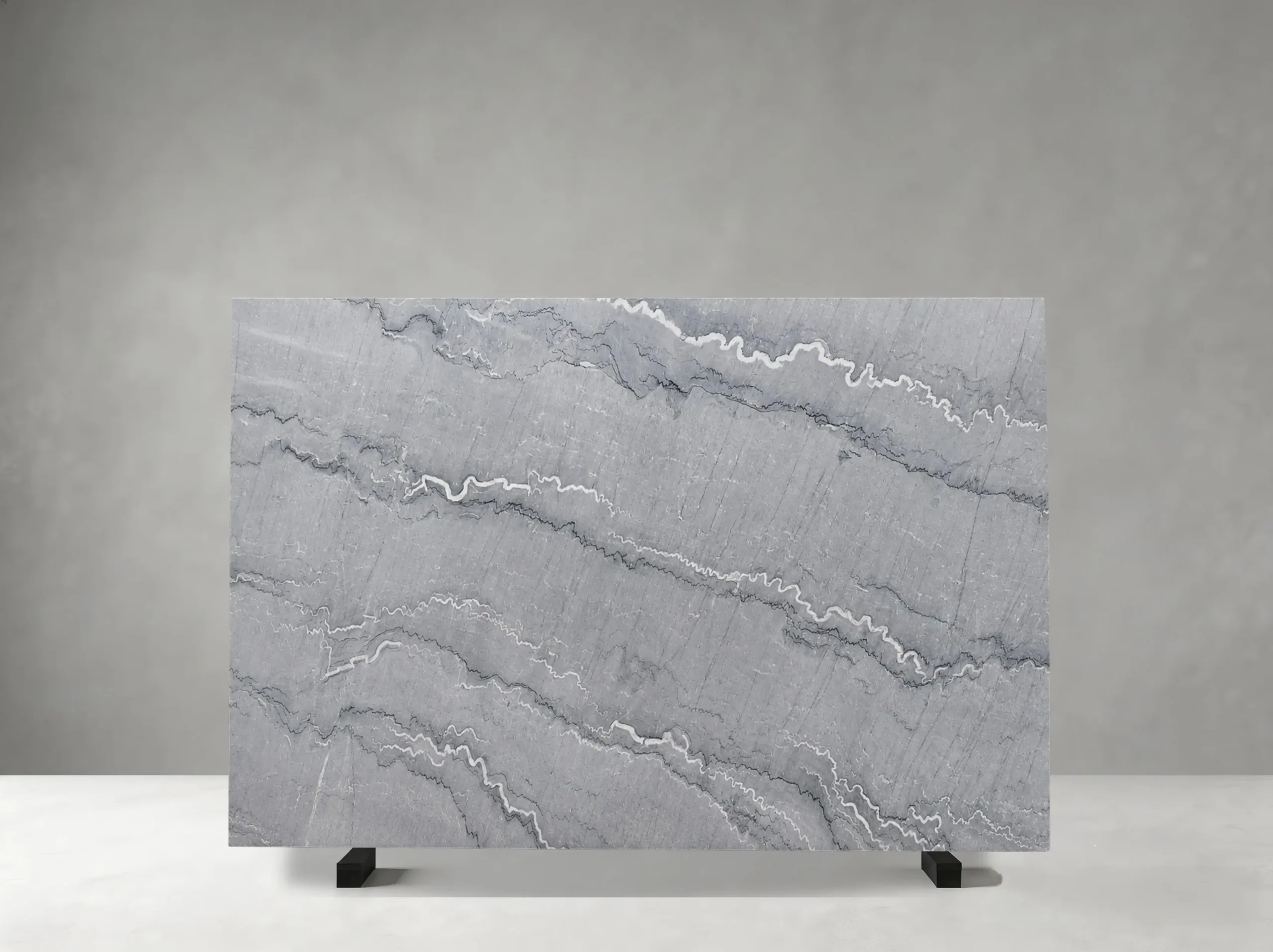 bruce-grey-marble-slab-white-wavy-veining-04.webp bruce grey marble slab with white wavy veining and silver grey layered movement