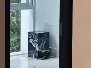 bvlgari black marble block side table with black base and white breccia veins