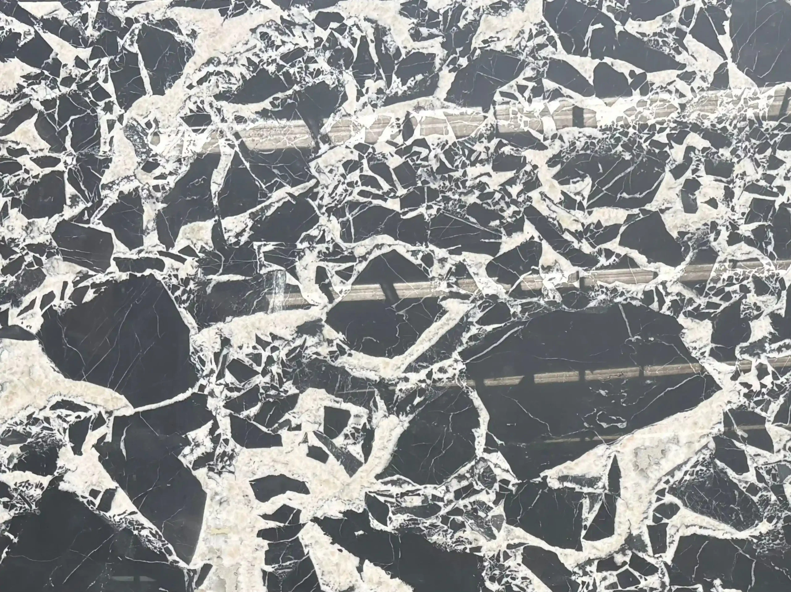 bvlgari-black-marble-slab-black-white-breccia-03.webp bvlgari black marble close up black and white breccia pattern for custom interiors