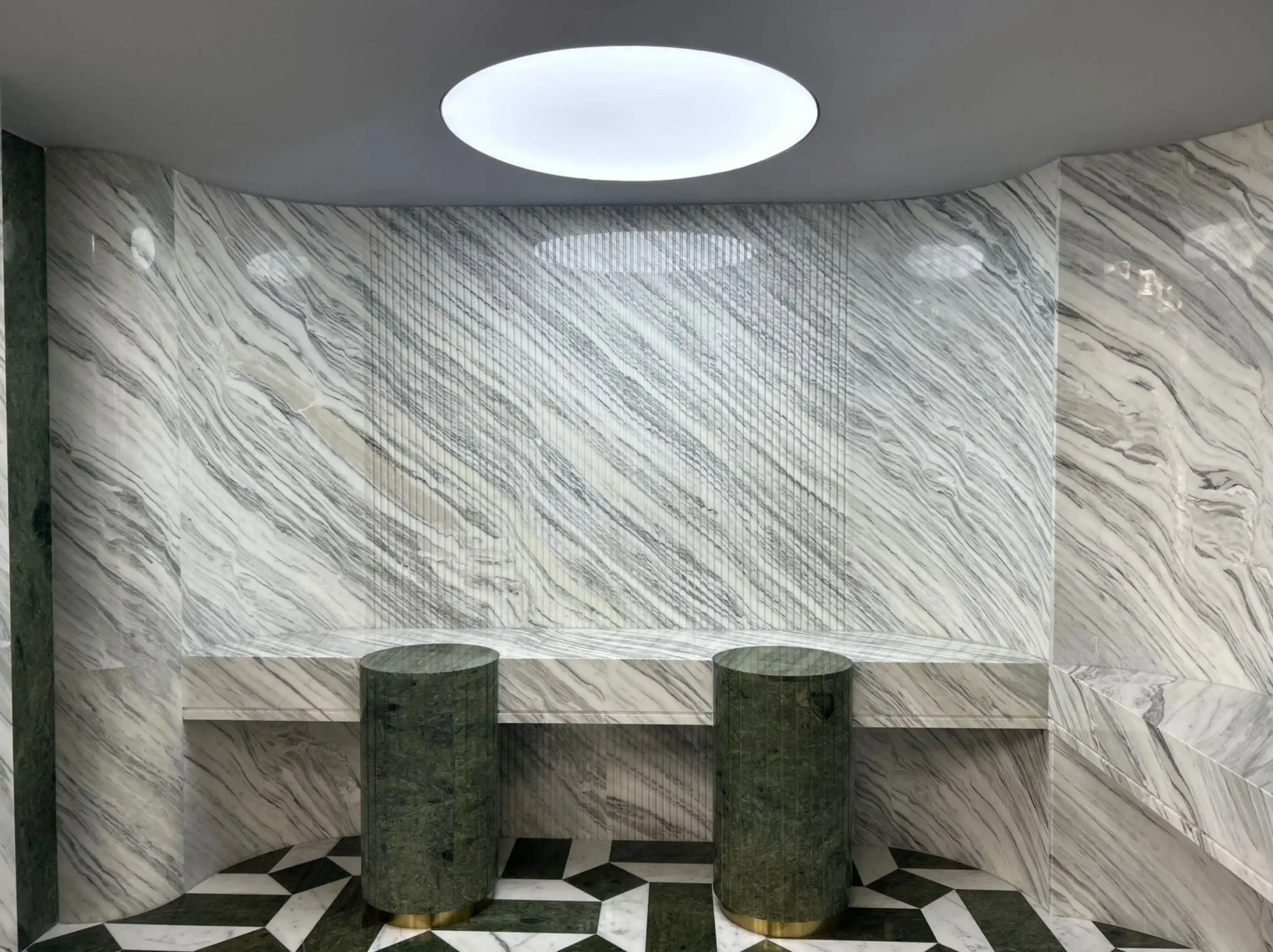 calacatta-armani-marble-commercial-interior-wall-cladding.webp Calacatta Armani Marble wall cladding and geometric flooring in a luxury commercial interior