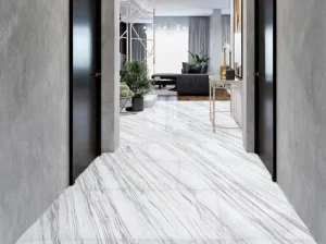 Calacatta Armani Marble flooring with directional grey veins in a modern residential corridor