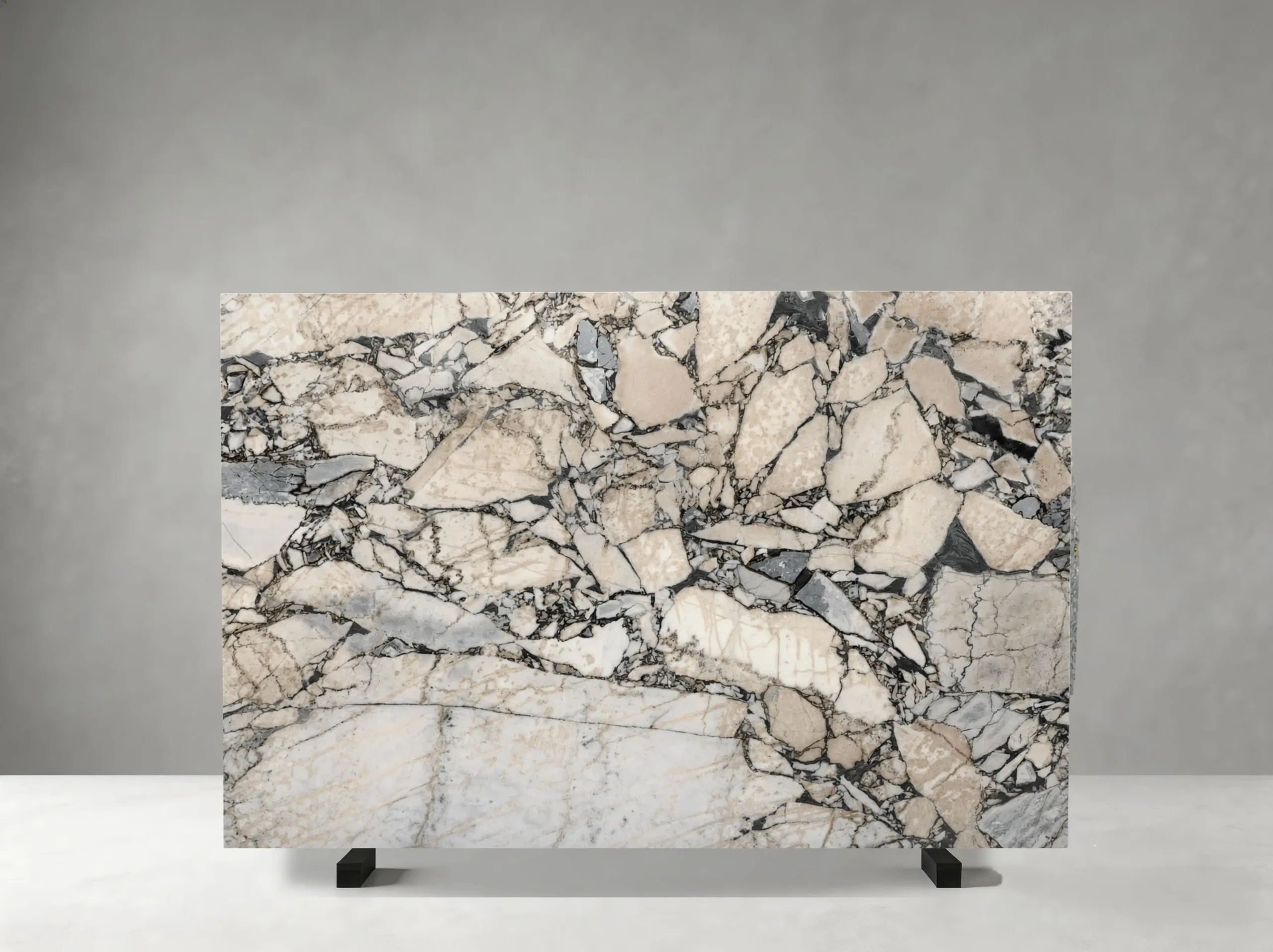 elephant-white-marble-slab-brecciated-pattern-04.webp elephant white marble slab with ivory beige grey fragments and dramatic dark brecciated pattern