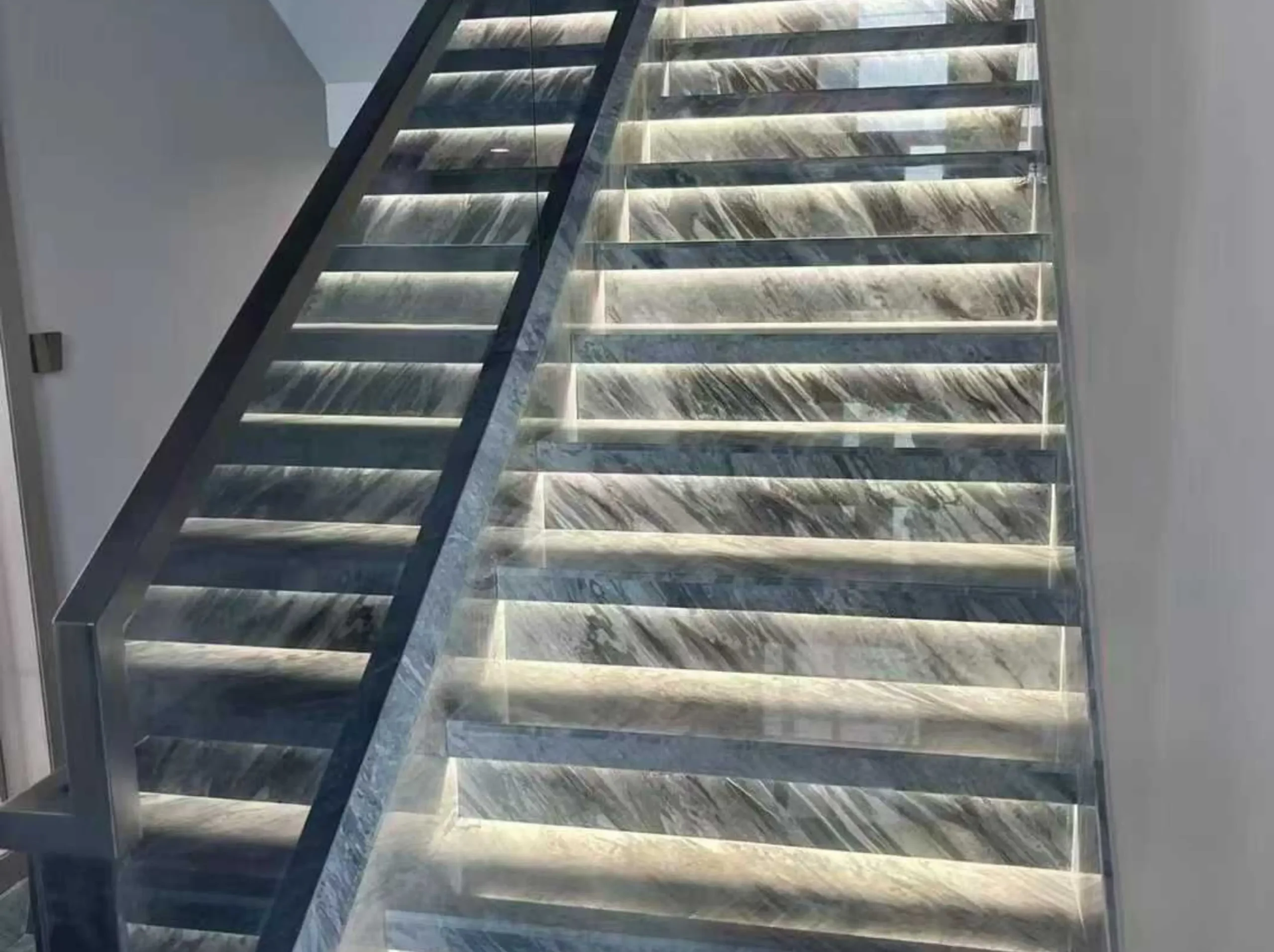 florence-grey-marble-illuminated-staircase-01.webp Florence Grey Marble staircase with integrated step lighting