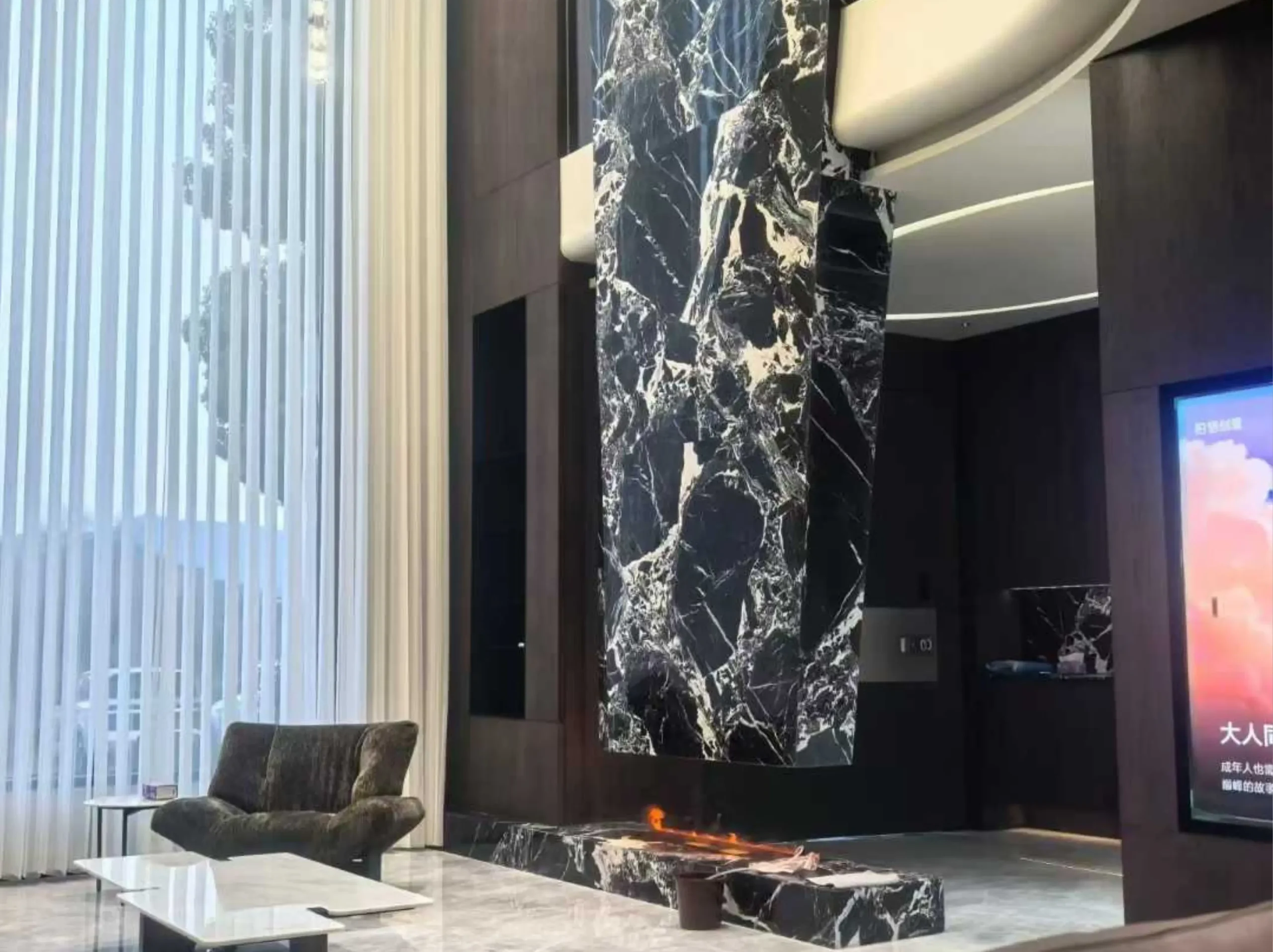 french-black-marble-fireplace-feature-wall-02.webp french black marble fireplace feature wall with bold black and white marble pattern