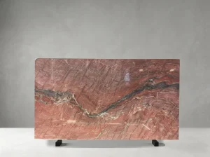 Fusion Fire Quartzite slab with red background and diagonal charcoal vein