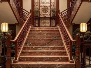 Fusion Fire Quartzite staircase with rich red and dark natural veins