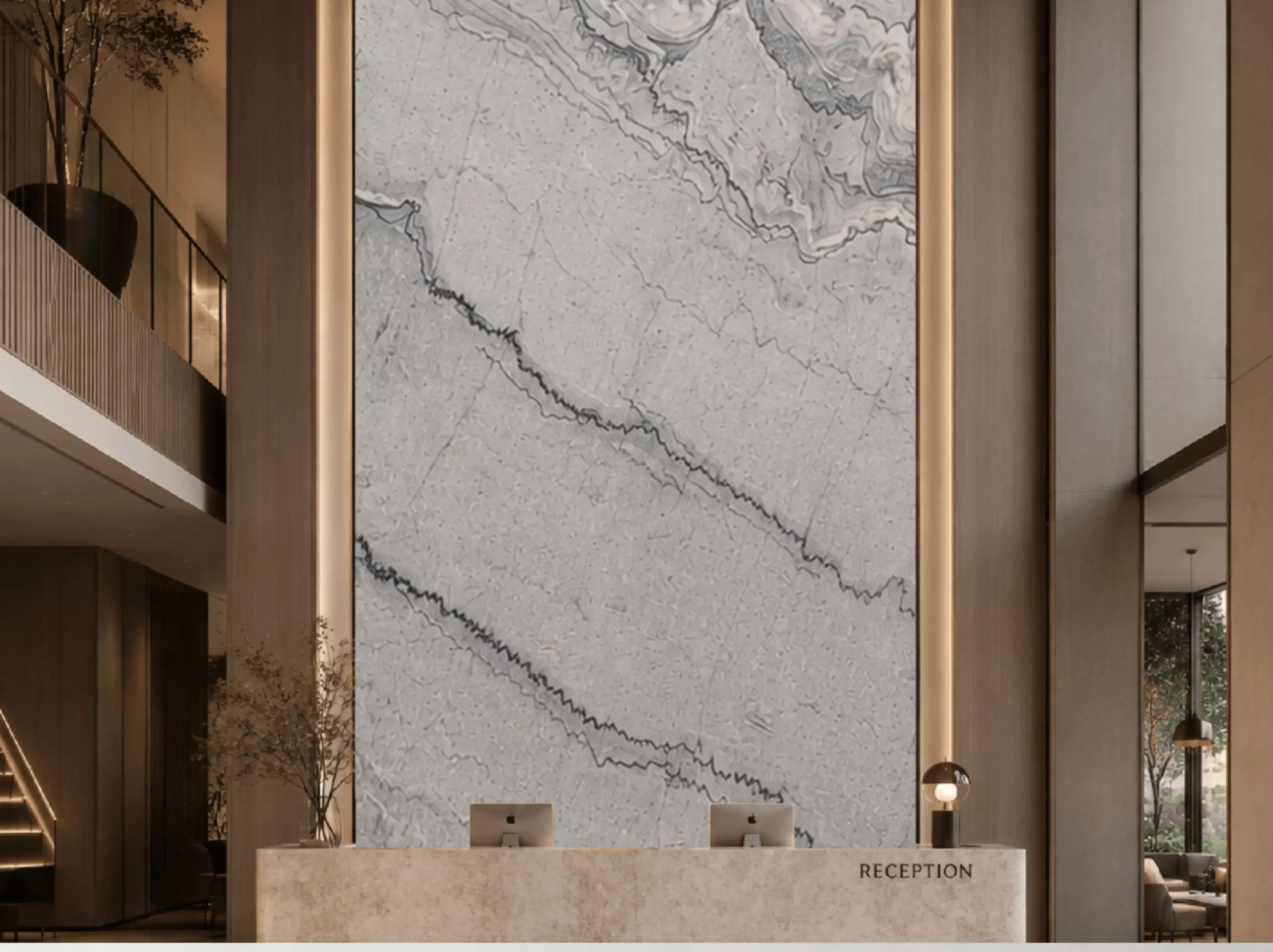 gray-bruce-marble-reception-feature-wall-01.webp gray bruce marble reception feature wall with light grey surface and dark layered mineral lines
