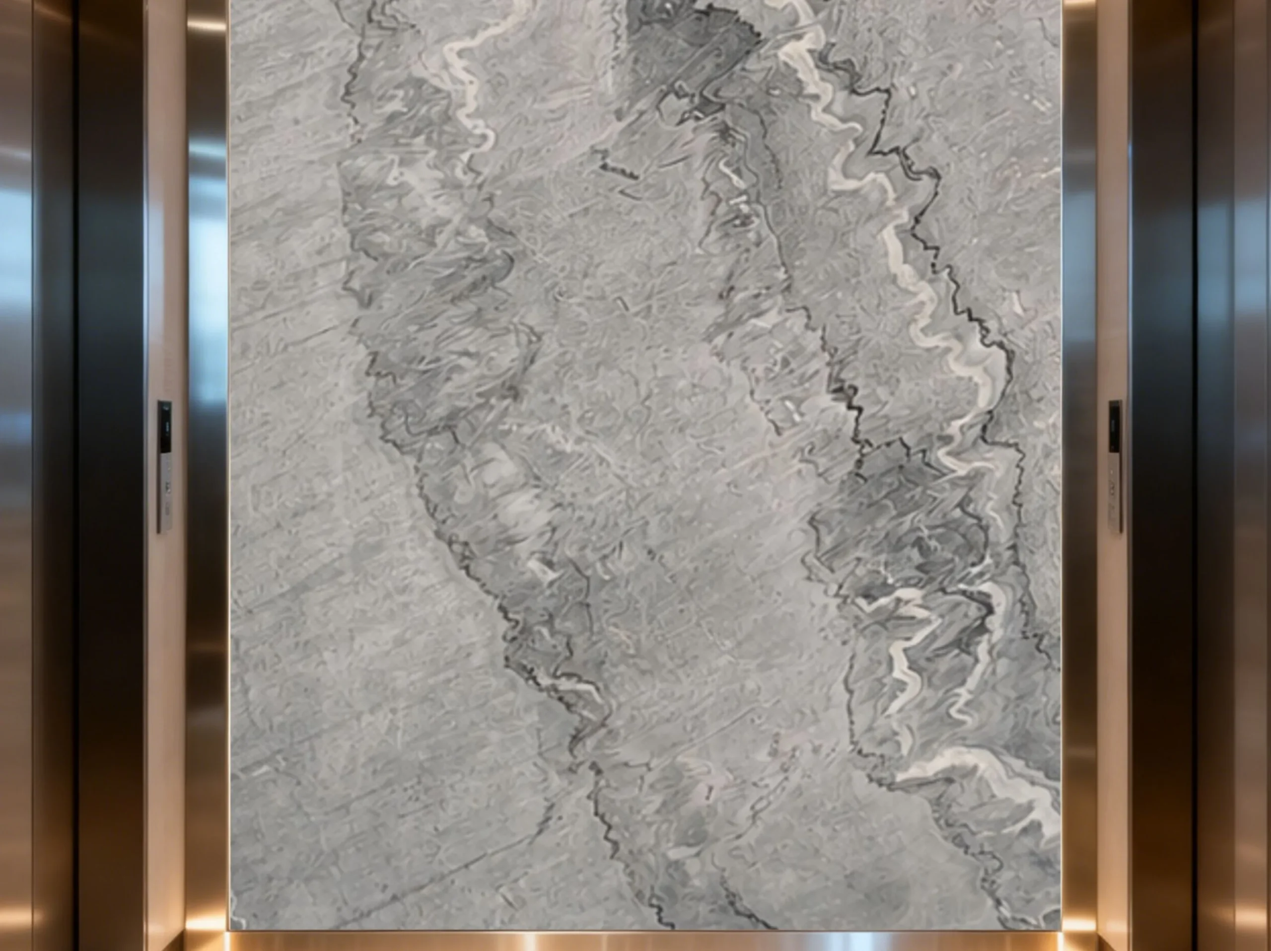 grey-bruce-marble-elevator-feature-wall-03.webp grey bruce marble elevator feature wall with layered grey mineral movement and white veining