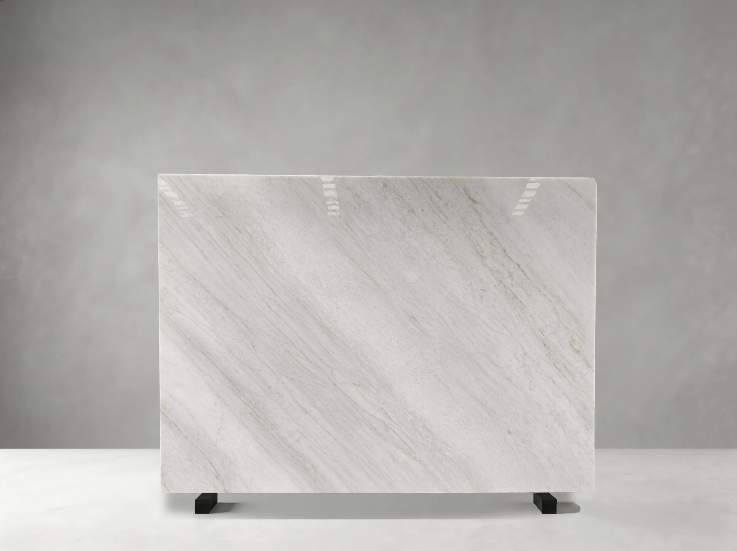 guanxi-carrara-white-marble-polished-slab-01.jpg Polished Guanxi Carrara White Marble slab with subtle diagonal grey and beige veins