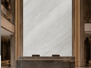 Guanxi Carrara White Marble reception feature wall with warm architectural lighting