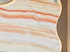 iran rainbow onyx curved illuminated wall detail with cream peach orange and translucent layered bands