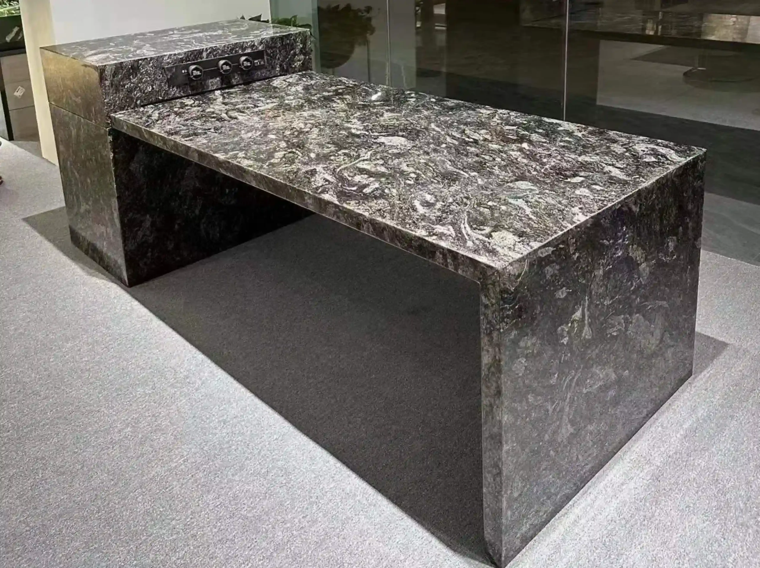 kozmus-black-granite-custom-stone-worktable-02.webp kozmus black granite custom stone worktable with dark grey and silver mineral pattern