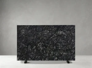 kozmus granite slab with dark black charcoal and silver mineral texture
